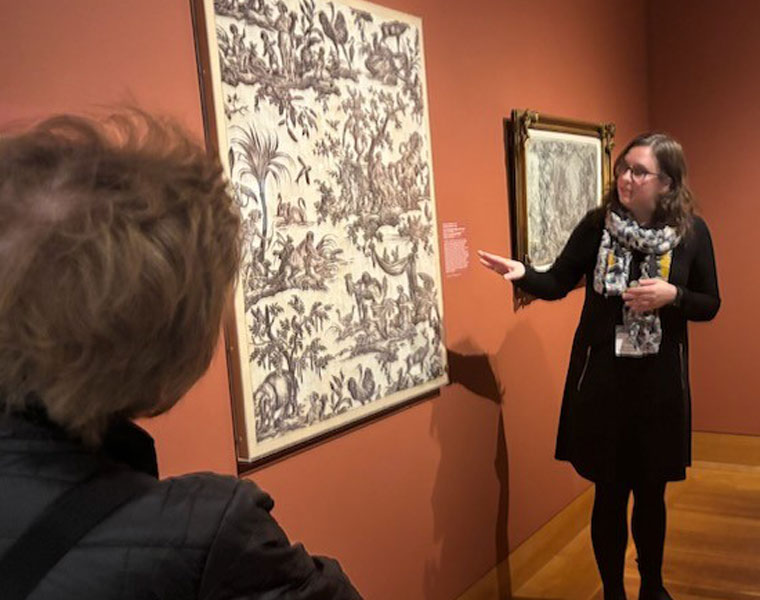 Photo of Jillian Kruse talking about a artwork on display