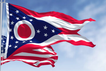 Stock image of Ohio state flag and U.S. flag