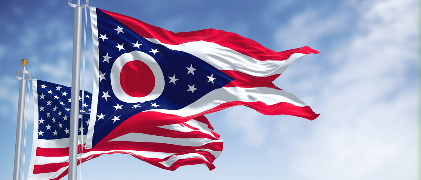 Stock image of Ohio state flag and U.S. flag