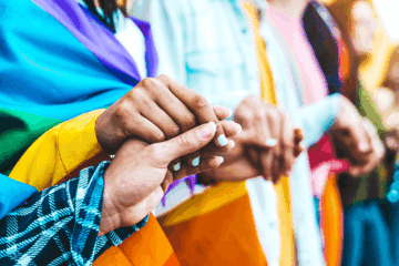 A group of young people holding hands