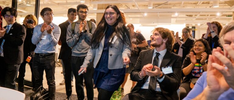 Participants smile and applaud at the Morgenthaler-Pavey Startup Competition.