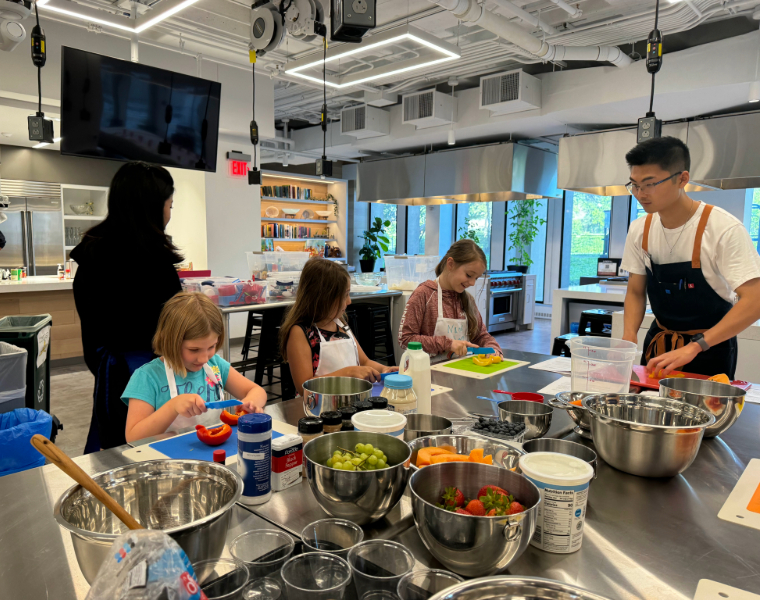 Photo of children making meals in the teaching kitchen